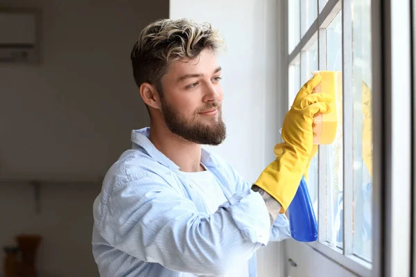 Handsome Young Man Sponge Cleaning Window Home — Stock Photo, Image