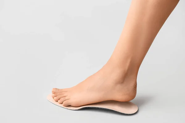 Female Foot Orthopedic Insole Light Background — Stock Photo, Image