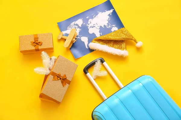 Blue Suitcase Christmas Gift Boxes Wooden Airplane Santa Hat World — Stock Photo, Image