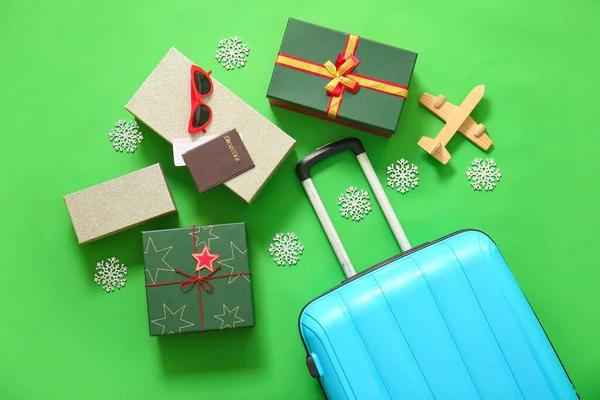 Blue Suitcase Christmas Gift Boxes Sunglasses Passport Wooden Airplane Green — Stock Photo, Image