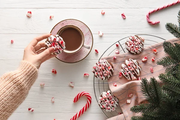 Woman Drinking Coffee Tasty Candy Cane Cookies White Wooden Background — Stock Photo, Image