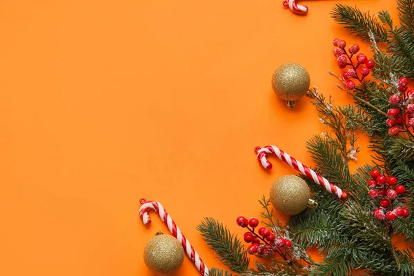 Beautiful Christmas Composition Fir Branches Candy Canes Orange Background — Stock Photo, Image