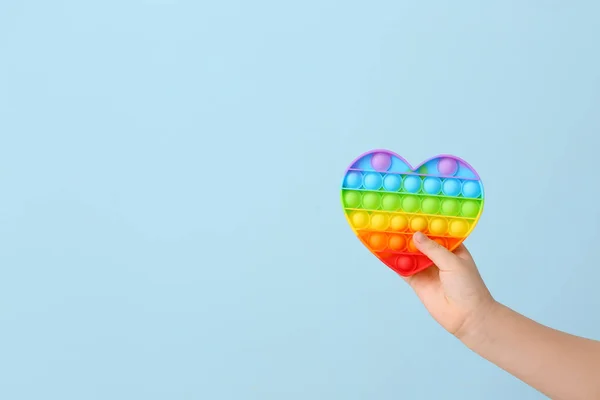 Child Hand Heart Shaped Pop Fidget Toy Color Background — Foto Stock