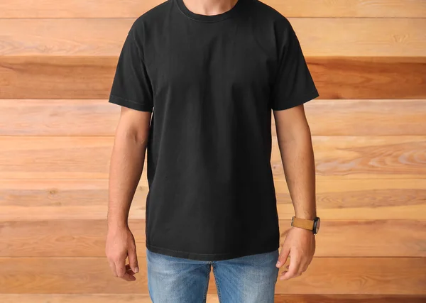 Stylish Young Man Black Shirt Wooden Background — Stock Photo, Image