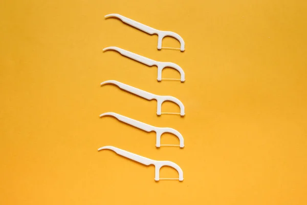 Floss Toothpicks Orange Background — Stock Photo, Image