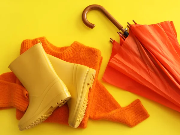 Rubber Boots Umbrella Sweater Yellow Background Closeup — Stockfoto