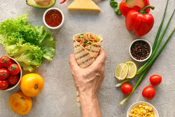 Man Tasty Burrito Ingredients Grey Background — Stock Photo, Image