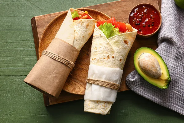Board Tasty Mexican Burritos Vegetables Green Wooden Background — Stock Photo, Image