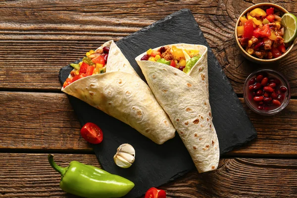 Board Tasty Mexican Burritos Vegetables Wooden Background — Stock Photo, Image