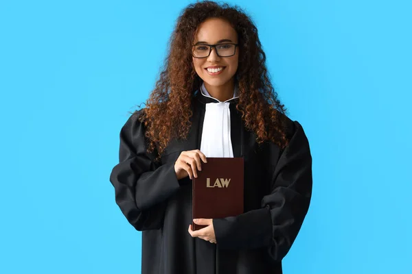 Young Female Judge Law Book Color Background — Stock Photo, Image