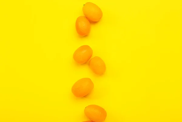 Tasty Kumquat Fruits Yellow Background — Stock Photo, Image
