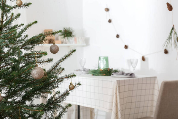 Beautiful decorated Christmas tree in festive room, closeup