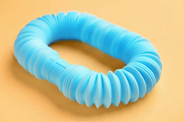Blue Pop Tube Narancs Alapon Közelről — Stock Fotó