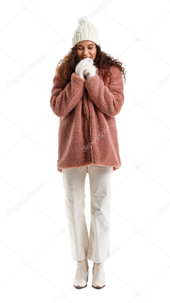 Beautiful young woman in stylish winter clothes on white background