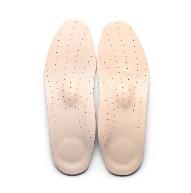 Beyaz arkaplanda bej ortopedik tabanlar