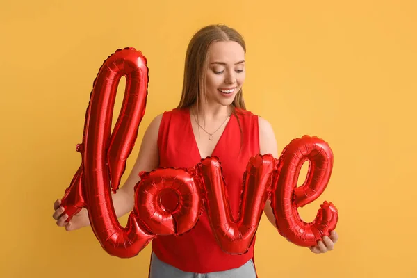 Young Woman Balloon Shape Word Love Color Background Valentine Day — Fotografia de Stock