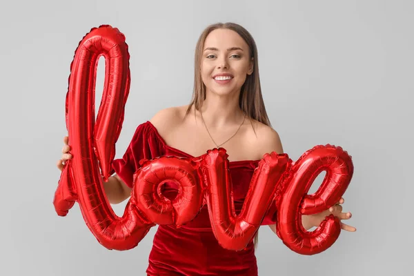 Young Woman Balloon Shape Word Love Grey Background Valentine Day — Stock Photo, Image