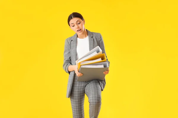 Surprised Teenage Girl Folders Yellow Background — Stockfoto