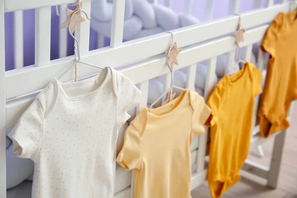 Baby Bodysuits Hanging Crib Children Bedroom Closeup — Stock Photo, Image