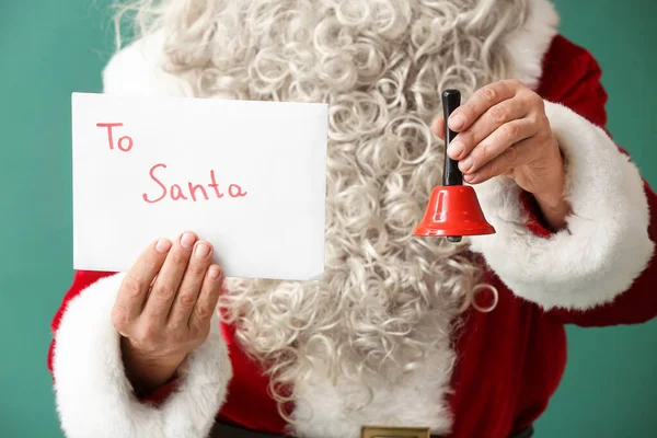 Santa Claus Christmas Bell Letter Green Background Closeup — Stockfoto