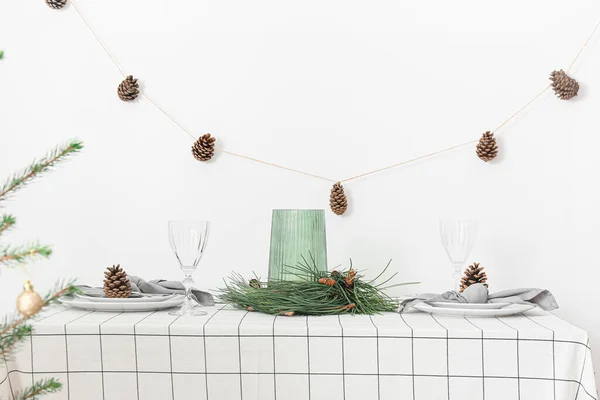 Beautiful Table Setting Pine Cones Fir Branches White Wall — Stock Photo, Image