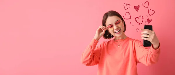 Beautiful Young Woman Phone Sending Love Message Pink Background — Stockfoto