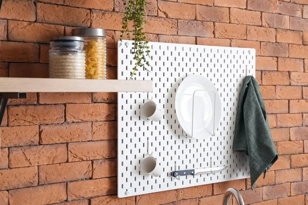 Peg Board Kitchenware Hanging Brick Wall — Stock Photo, Image