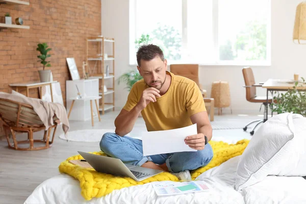 Thoughtful Young Man Document Sitting Bed Home — Stock Photo, Image