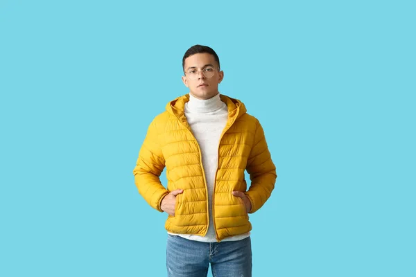 Young Man Eyeglasses Yellow Jacket Blue Background — Stock Photo, Image