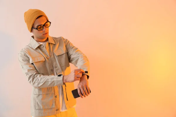 Young Man Stylish Jacket Mobile Phone Color Background — Stock Photo, Image