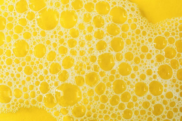 Water Soap Foam Yellow Background Closeup — стоковое фото