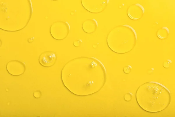 Drops Liquid Transparent Gel Bubbles Yellow Background — ストック写真