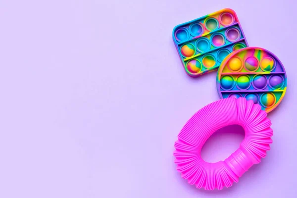 Colorful Pop Tube Pop Fidget Toys Purple Background — Stock Photo, Image