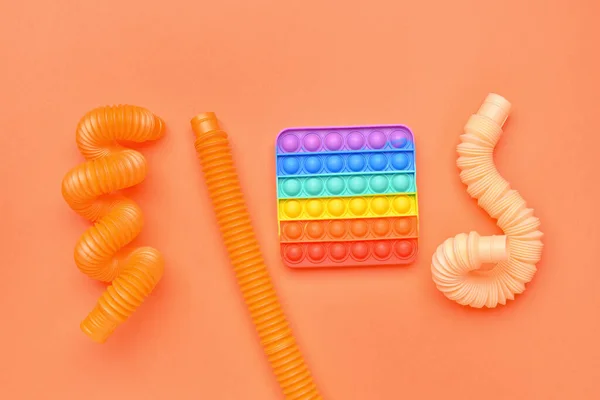 Färgglada Pop Tubes Och Pop Det Fidget Leksak Orange Bakgrund — Stockfoto