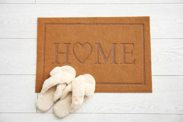 Door Mat Word Home Slippers White Wooden Floor — Stock Photo, Image