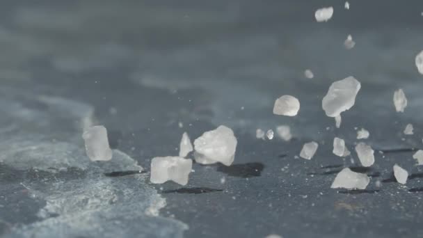 Pouring Sea Salt Grey Surface Closeup — Stockvideo