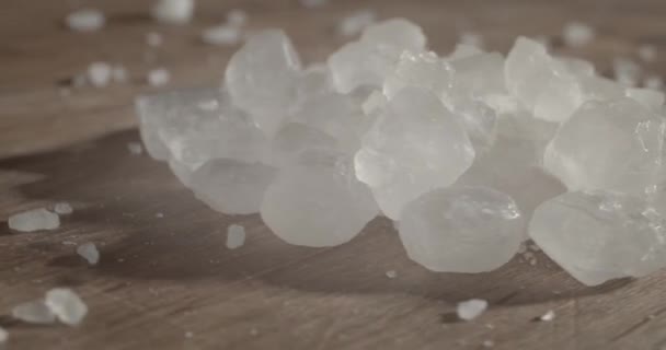 Pouring Sea Salt Wooden Surface Closeup — Wideo stockowe