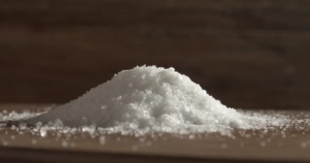 Spooning Salt Heap Wooden Background — Wideo stockowe