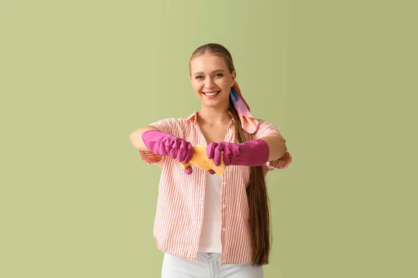 Young Woman Squeezing Sponge Color Background — Stock Photo, Image