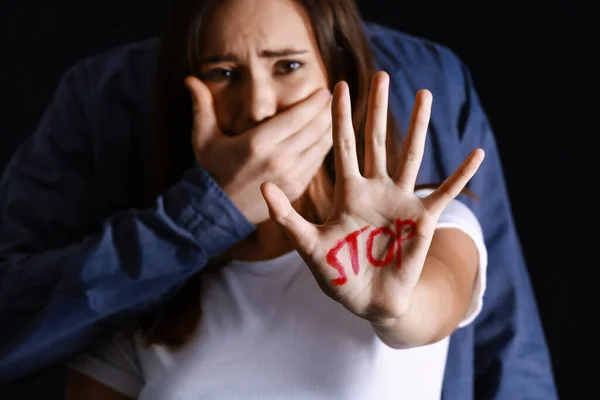 Man Covering Mouth Scared Young Woman Dark Background Violence Concept — Stock Photo, Image
