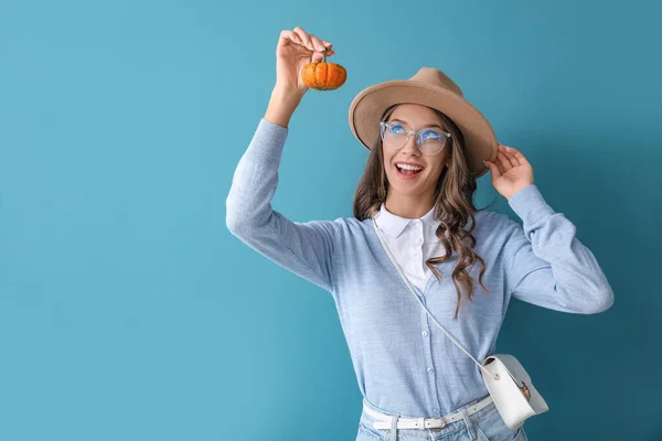 Young Happy Woman Holding Small Pumpkin Blue Background — Stockfoto