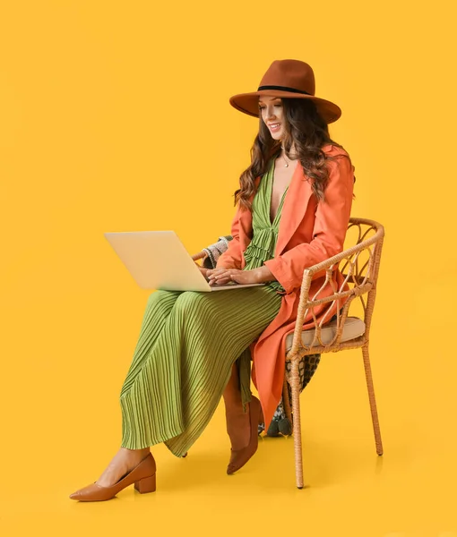 Young Fashionable Woman Sitting Chair Using Laptop Yellow Background — Stock Photo, Image