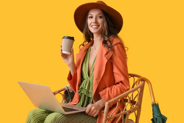 Young Fashionable Woman Sitting Chair Laptop Paper Cup Drink Yellow — 스톡 사진
