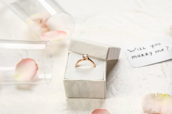 Box Golden Engagement Ring Glasses Rose Petals White Background Closeup — Stock Photo, Image
