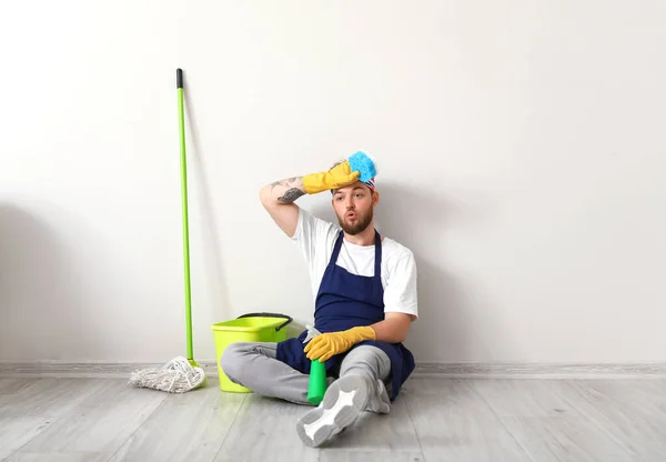 Handsome Young Man Tired Cleaning Home — Stockfoto