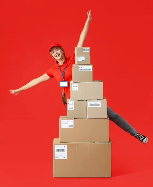 Female Courier Many Parcels Color Background — Stock Photo, Image