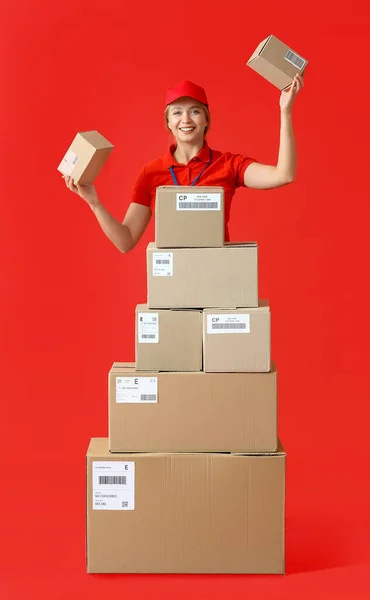 Female Courier Many Parcels Color Background — Stock Photo, Image