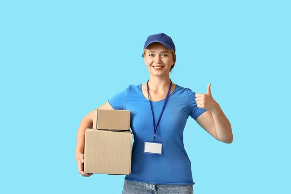 Female Courier Parcels Showing Thumb Color Background — Stock Photo, Image
