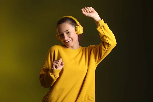 Cool Young Woman Listening Music Dancing Dark Background — Stockfoto
