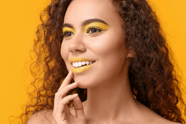 Beautiful African American Woman Makeup Yellow Tones Color Background — стоковое фото